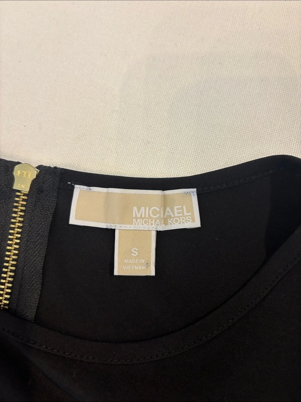 Michael Kors classic black short sleeve A-line with gold zipper mini dress. S